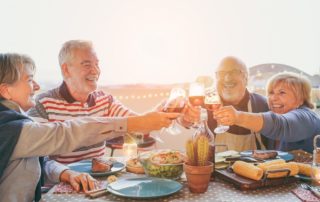 oakleigh-senior-living group of seniors smiling at dinner table