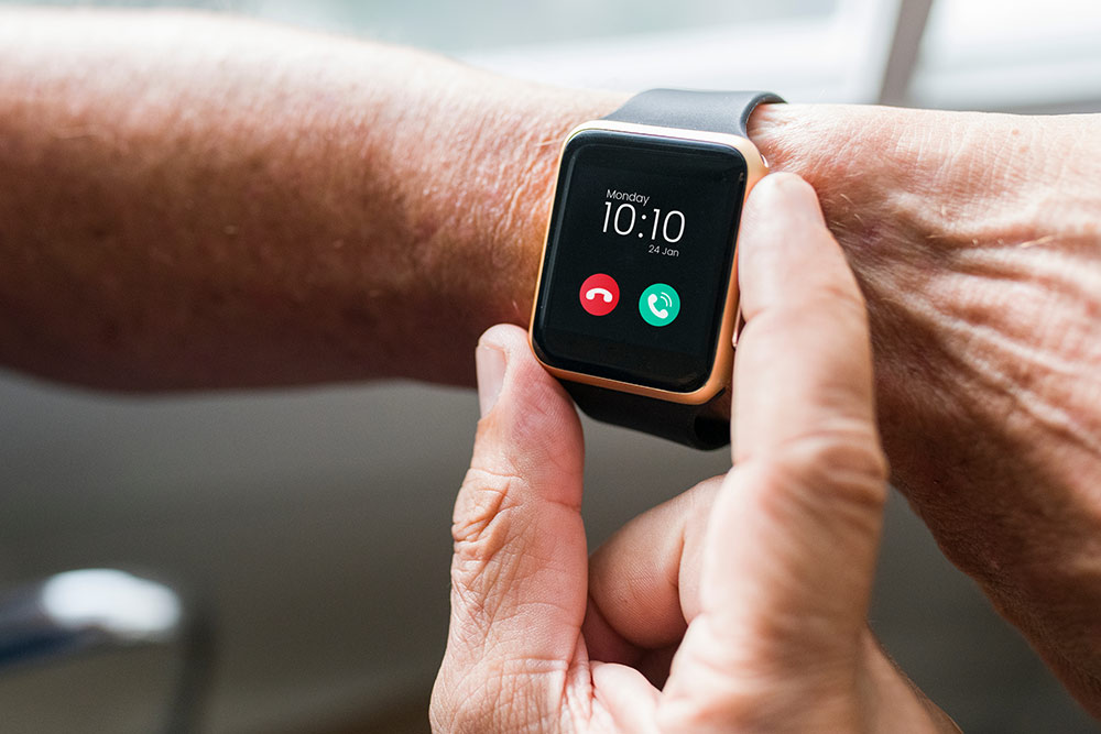Close up of digital Apple watch on senior wrist with time showing