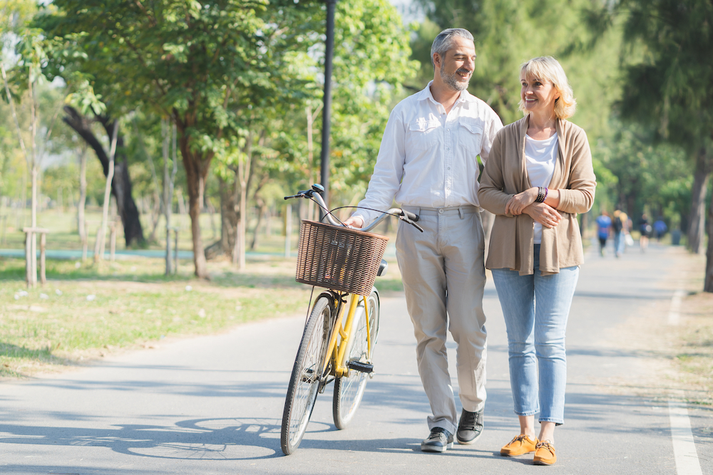A senior couple on a walk outdoors